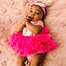 baby, infant, pink_tutu, headband, blanket, heart_pattern, lying_down, cute, child, portrait, clothing, soft_texture, adorable, young, looking_at_camera, hands, skin, person, indoors, fashion
