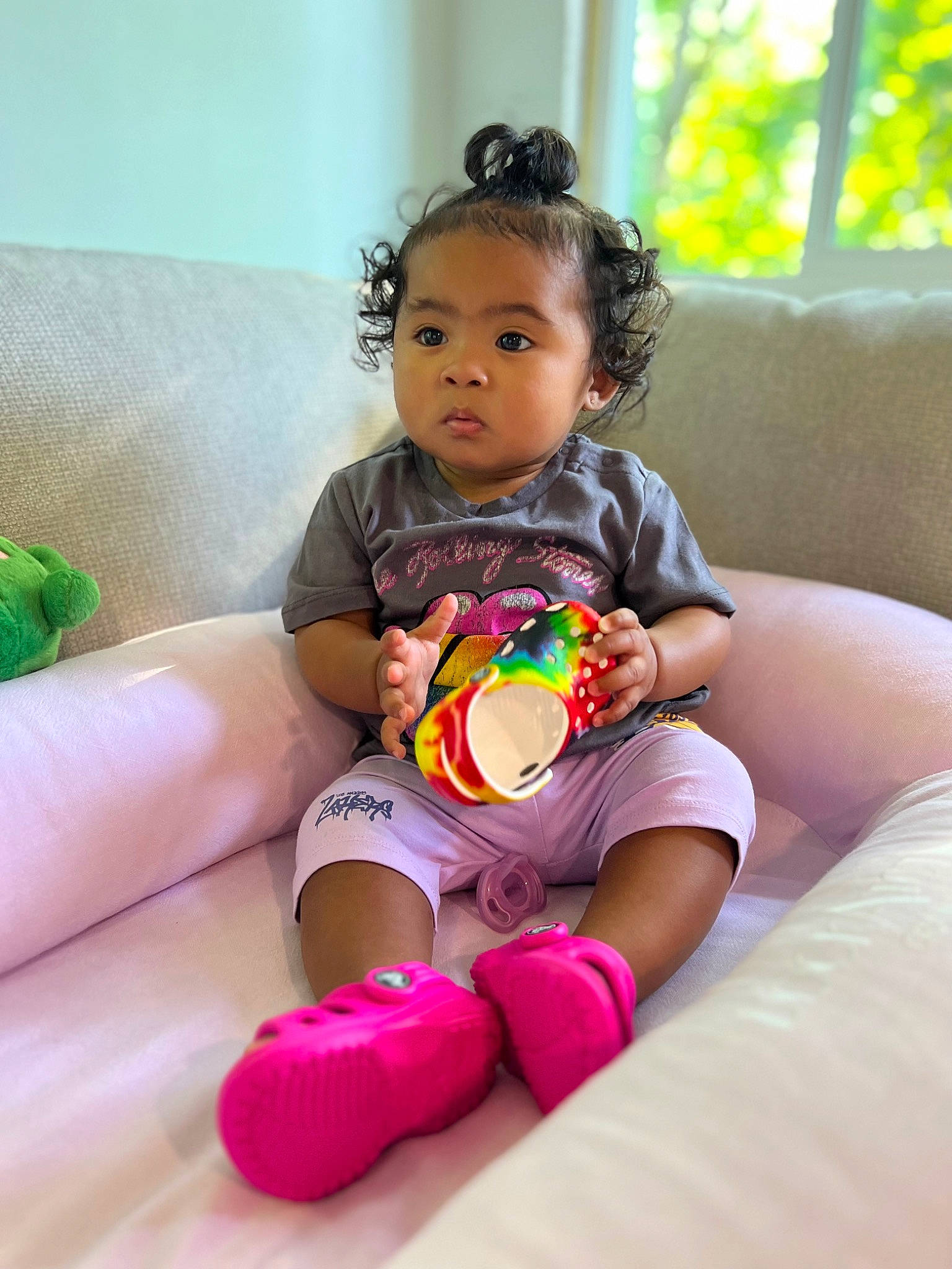 Mika joined the competition — help win amazing prizes! baby, baby_playing_with_toys, baby_toddler_clothing, child, comfort, couch, facial_expression, finger, foot, fun, grass, happy, human_leg, knee, leisure, person, pink, skin, sock, thigh