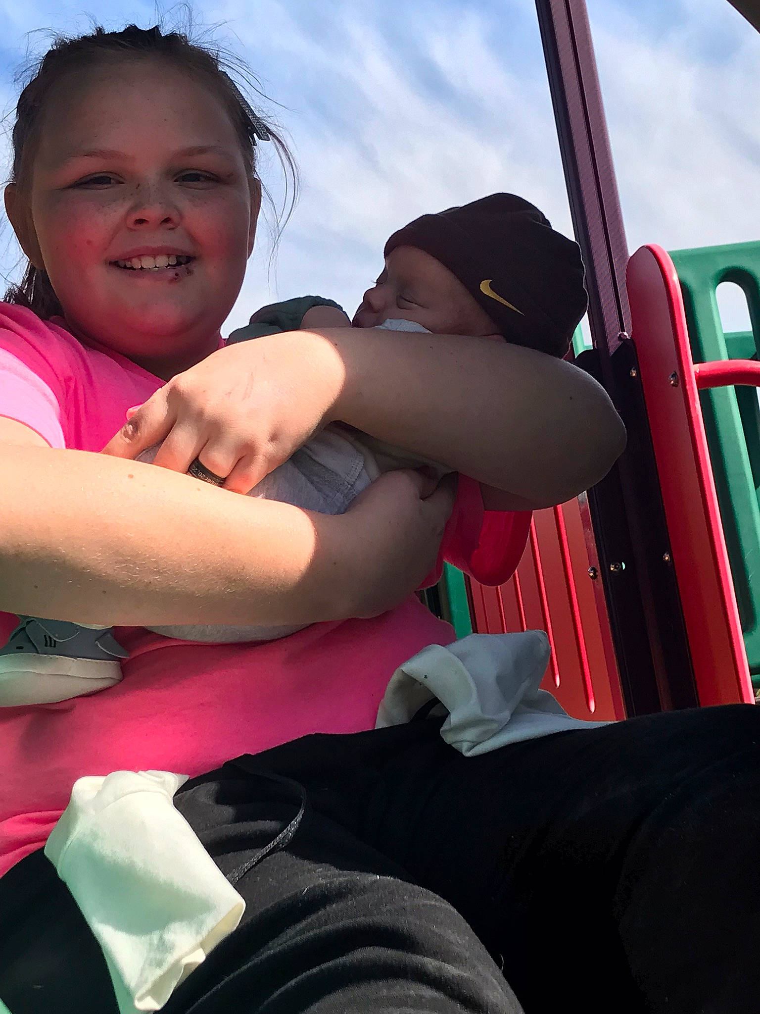 Alexander is registered to the contest to win money with this photo: child, cloud, elbow, face, fun, gesture, grass, happy, headwear, joy, leisure, magenta, people, person, recreation, sitting, sky, smile, t_shirt, toddler