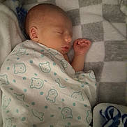 Braxton is registered to the contest to win money with this photo: baby, blanket, sleeping, newborn, infant, face, hand, cozy, cute, pattern, bear, polka_dots, soft, bed, rest, peaceful, child, portrait, indoor, comfort