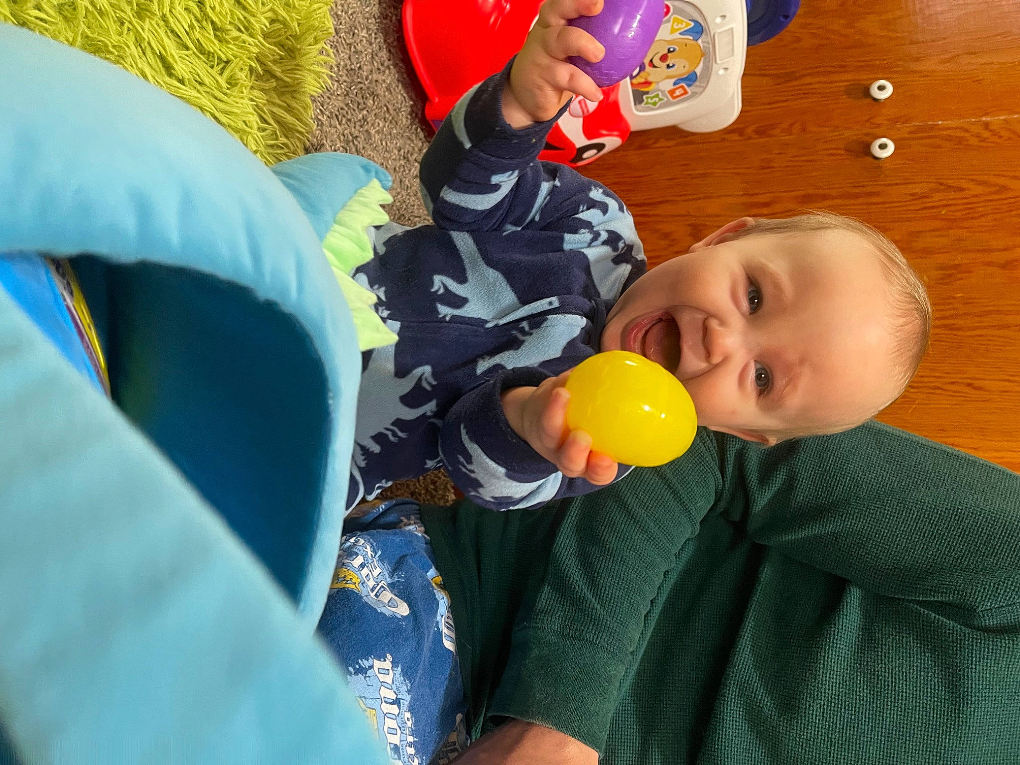 Sullivan is registered to the contest to win money with this photo: baby, baby_playing_with_toys, baby_products, baby_toys, child, comfort, event, flooring, fun, happy, leisure, party_supply, people, person, play, product, room, sitting, smile, toddler