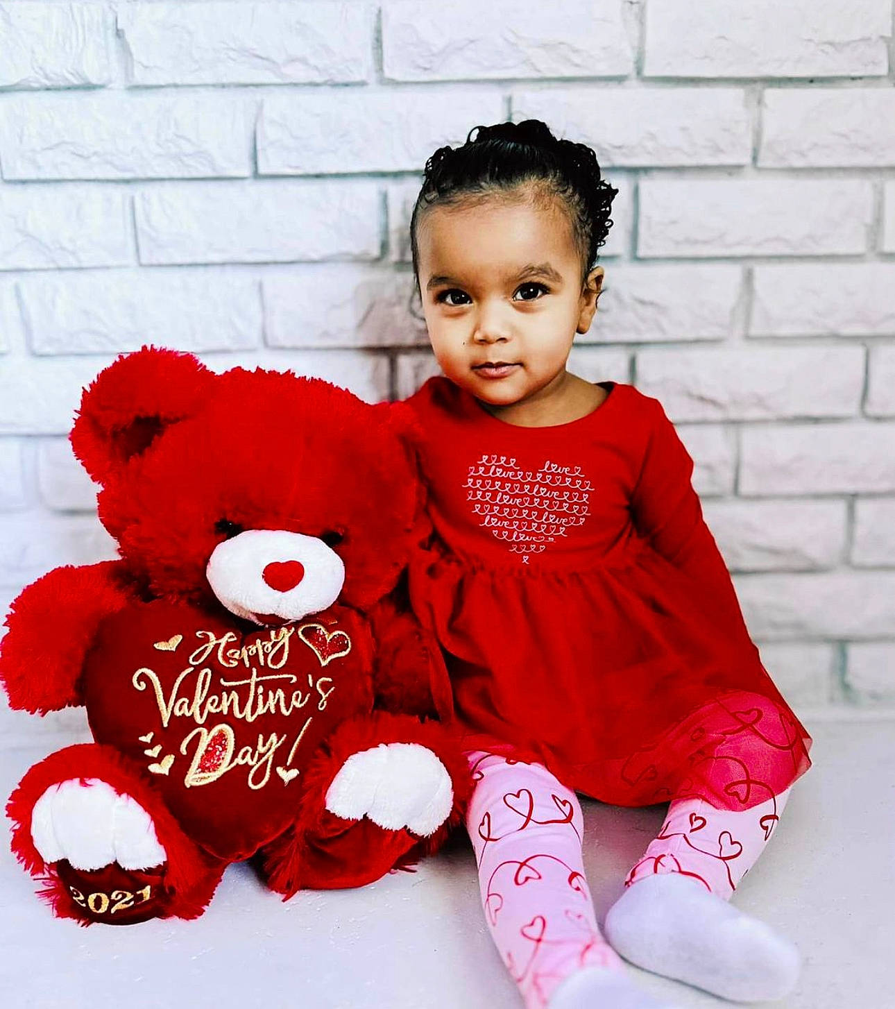 Daniela joined the competition — help win amazing prizes! baby, baby_toddler_clothing, carmine, child, fashion_accessory, font, happy, magenta, pattern, person, petal, pink, red, sleeve, smile, sock, stuffed_toy, teddy_bear, toddler, toy