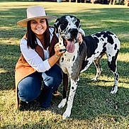 Major joined the competition — help win amazing prizes! woman, dog, great_dane, grass, outdoor, smiling, hat, crouching, sunlight, barn, trees, casual_clothing, pet, animal, happy, friendship, daytime, nature, leisure, black_and_white