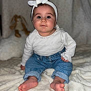 Valentina participe au concours pour gagner de l'argent avec cette photo : baby, child, headband, white_top, blue_jeans, barefoot, sitting, blanket, plush_toy, bunny, indoor, face, portrait, cute, infant, soft_texture, cozy, warm_lighting, curious, young_child
