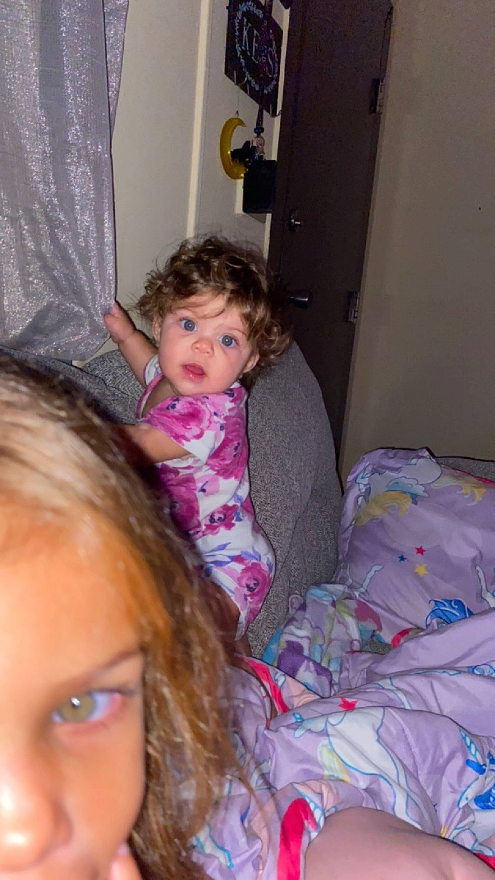 Kylee is registered to the contest to win money with this photo: blond, cheek, child, comfort, door, event, eye, eyelash, fun, hairstyle, happy, iris, lap, long_hair, mouth, nose, person, purple, skin, toddler