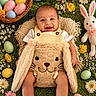baby, child, smiling, easter_eggs, bunny_costume, plush_toy, grass, flowers, yellow_flowers, white_flowers, pink_flowers, basket, spring, cute, outdoor, holiday, festive, portrait, infant, happy