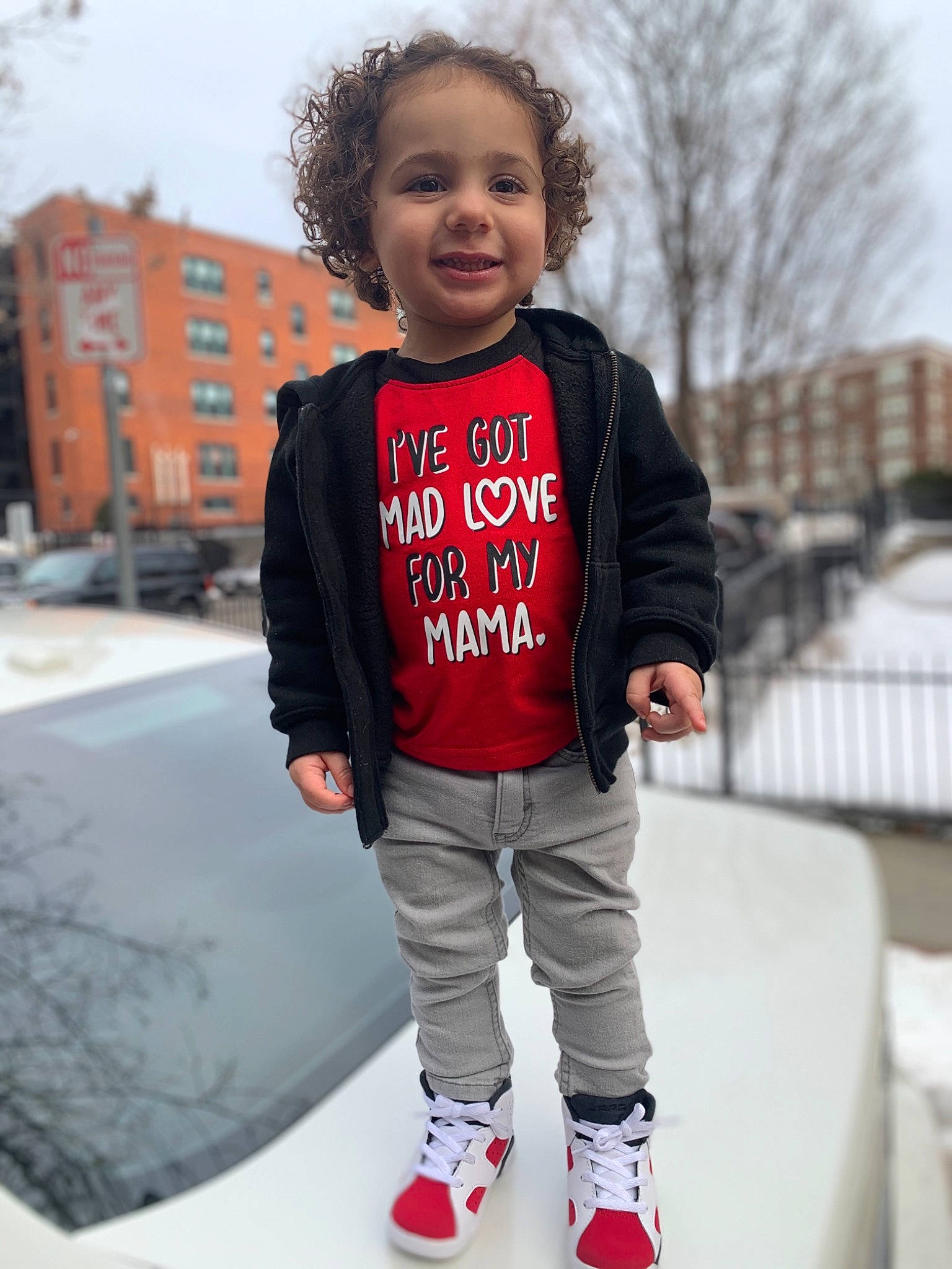 Valentino is registered to the contest to win money with this photo: baby_toddler_clothing, cool, electric_blue, face, flash_photography, footwear, happy, jersey, joy, knee, neck, outerwear, person, sky, sleeve, smile, sportswear, street_fashion, t_shirt, toddler