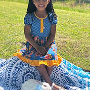 Amilyah is registered to the contest to win money with this photo: child, girl, smiling, outdoor, grass, dress, blue, yellow, ribbon, rabbit, white_rabbit, bow, blanket, patterned, sunny, nature, sitting, portrait, happy, animal
