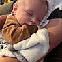 Kenai is registered to the contest to win money with this photo: baby, sleeping, blanket, arm, person, cozy, comfort, indoor, soft, cuddle, child, infant, rest, peaceful, warm, closeup, portrait, clothing, relax, toddler