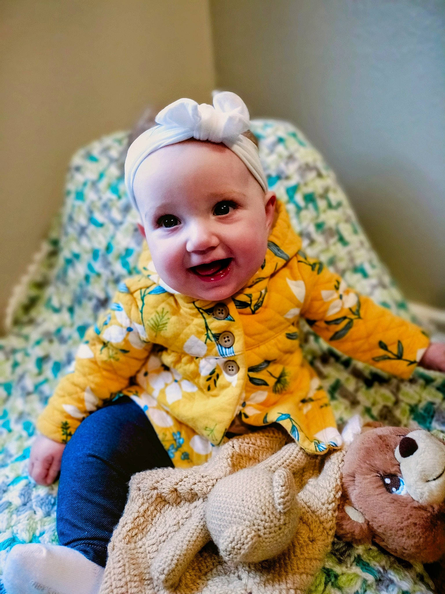 Jenny joined the competition — help win amazing prizes! baby, baby_products, baby_toddler_clothing, child, comfort, dress, facial_expression, fun, happy, hat, headband, orange, pattern, person, room, sitting, skin, sleeve, smile, toddler