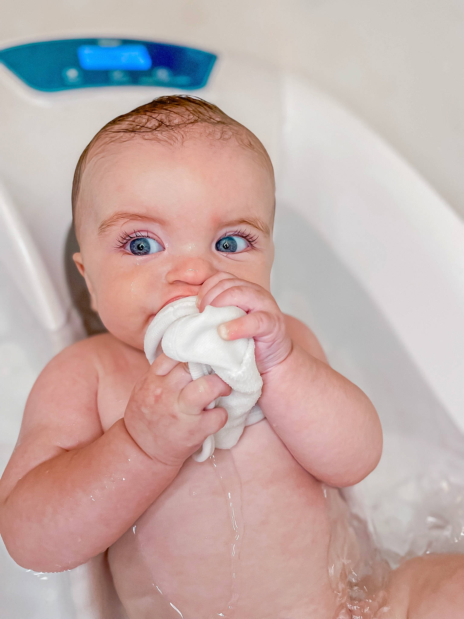 Landyn is registered to the contest to win money with this photo: baby, baby_bathing, bathing, blue, cheek, ear, eye, eyebrow, face, fluid, gesture, hair, hand, human_body, jaw, mouth, neck, nose, person, skin