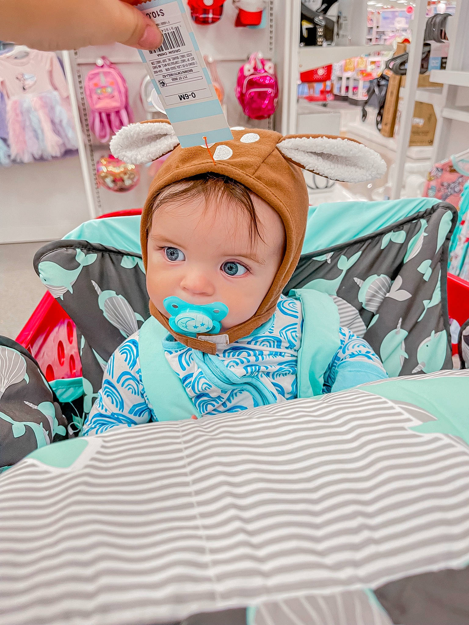 Landyn is registered to the contest to win money with this photo: baby, baby_products, baby_toddler_clothing, child, comfort, event, fun, happy, leisure, linens, magenta, person, pink, room, sitting, toddler