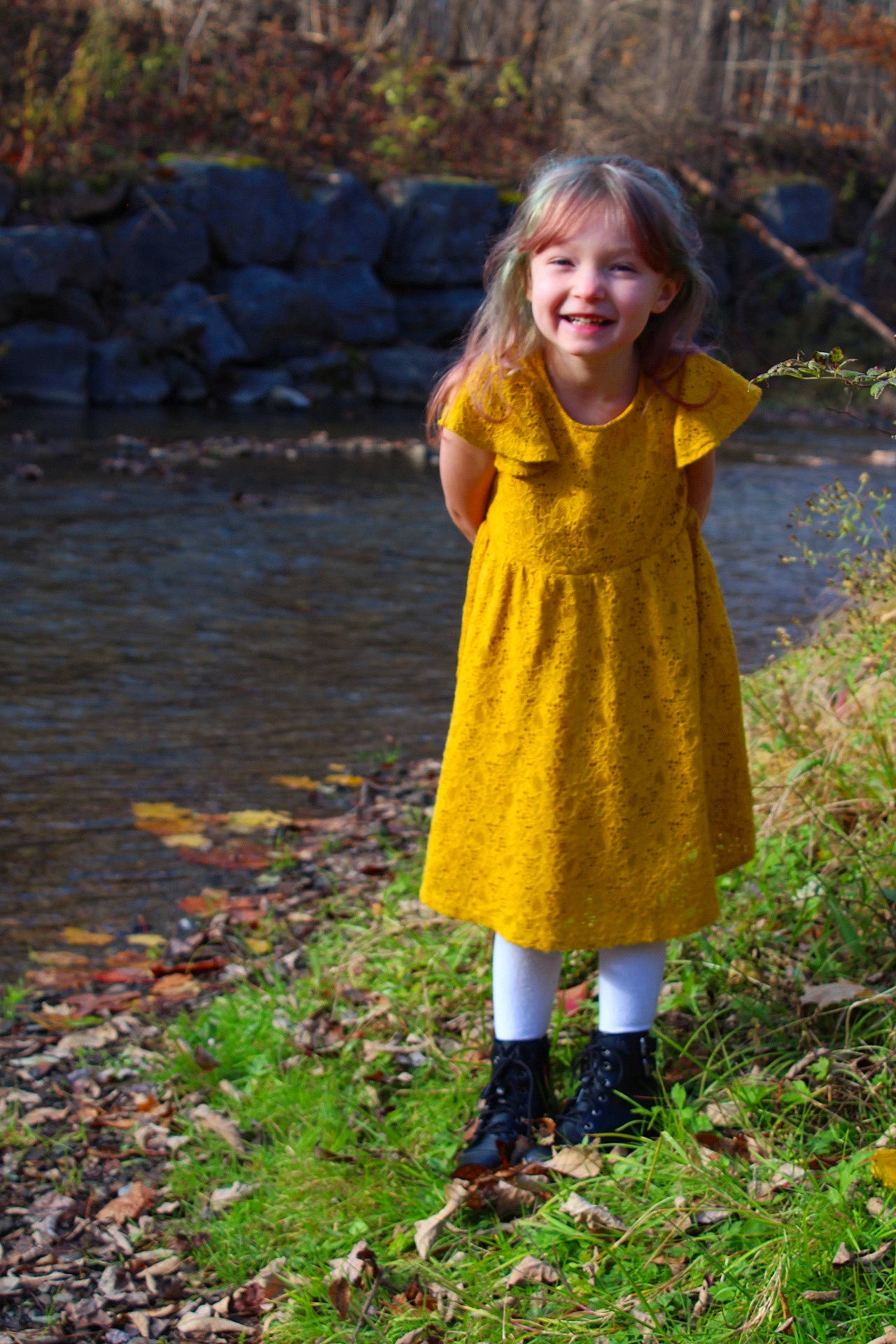 Haven is registered to the contest to win money with this photo: bank, dress, eye, fawn, forest, fun, grass, hair, happy, human_body, joy, leaf, leisure, long_hair, outerwear, people_in_nature, person, plant, smile, tree