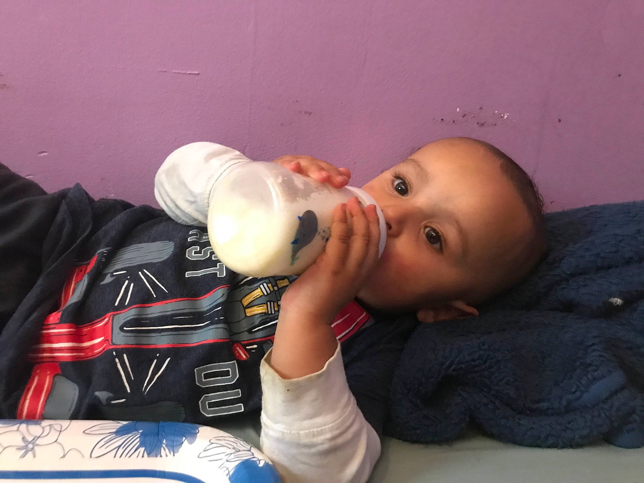 Layton is registered to the contest to win money with this photo: baby, baby_bottle, baby_products, bottle, carmine, cheek, child, comfort_food, dairy, drink, drinking, drinkware, food, infant_formula, milk, nail, person, plant_milk, plastic, plastic_bottle