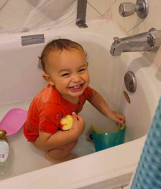 Layton joined the competition — help win amazing prizes! baby, bath_toy, bathing, bathroom, bathtub, child, fluid, fun, joy, person, play, plumbing, plumbing_fixture, product, room, skin, smile, tap, thumb, toddler