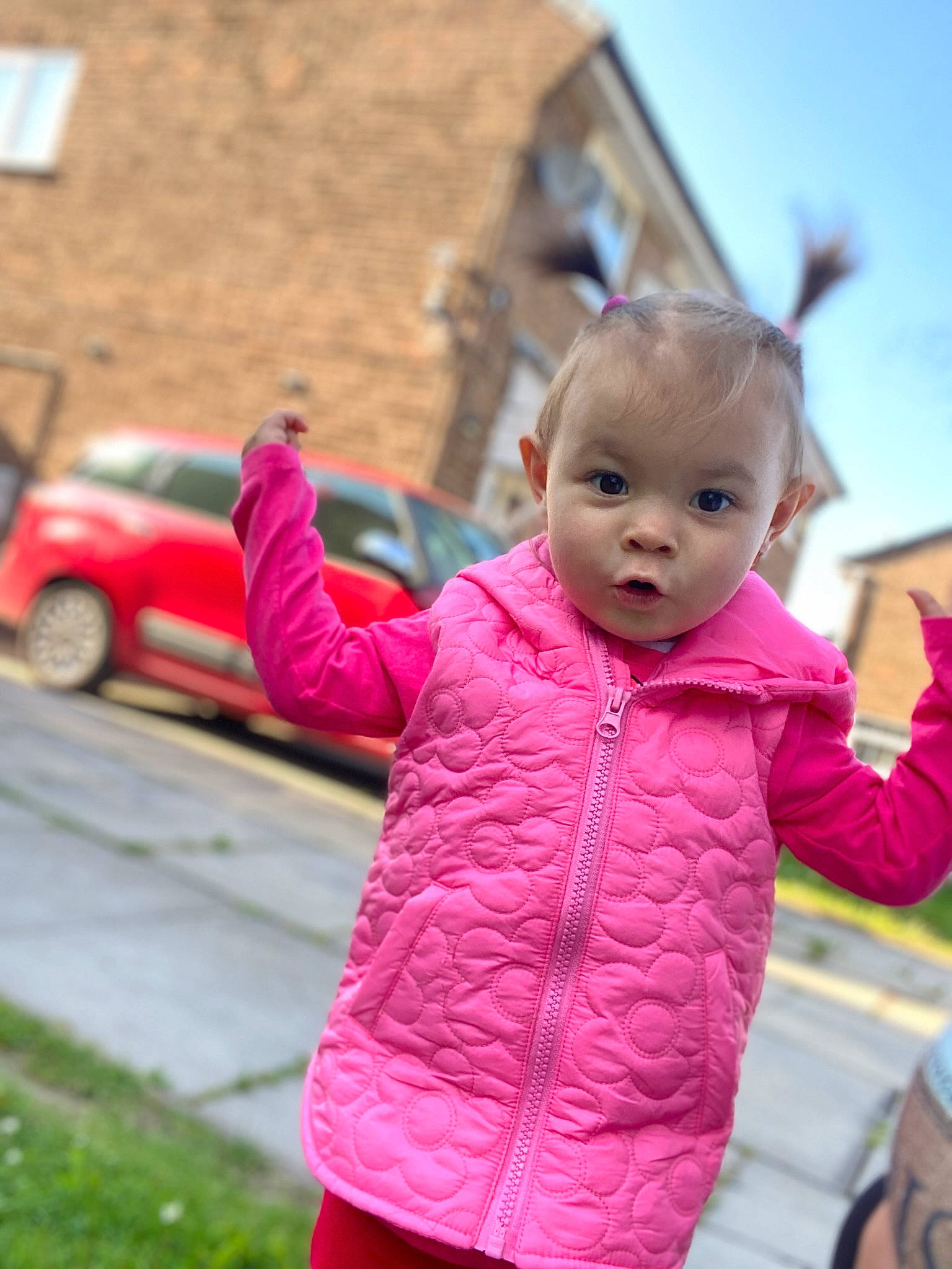 Melissa Maria is registered to the contest to win money with this photo: baby, baby_toddler_clothing, car, city, fun, gesture, grass, happy, jacket, leisure, magenta, person, pink, recreation, sky, sleeve, tire, toddler, travel, vehicle_door