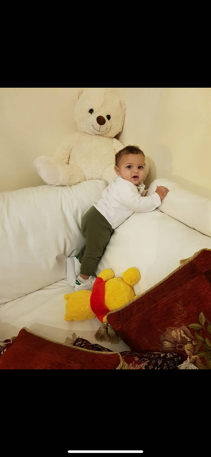Amir participe au concours pour gagner de l'argent avec cette photo : baby, baby_products, baby_toddler_clothing, baby_toys, bear, comfort, couch, home_accessories, living_room, person, pillow, plush, slipcover, stuffed_toy, teddy_bear, throw_pillow, toy