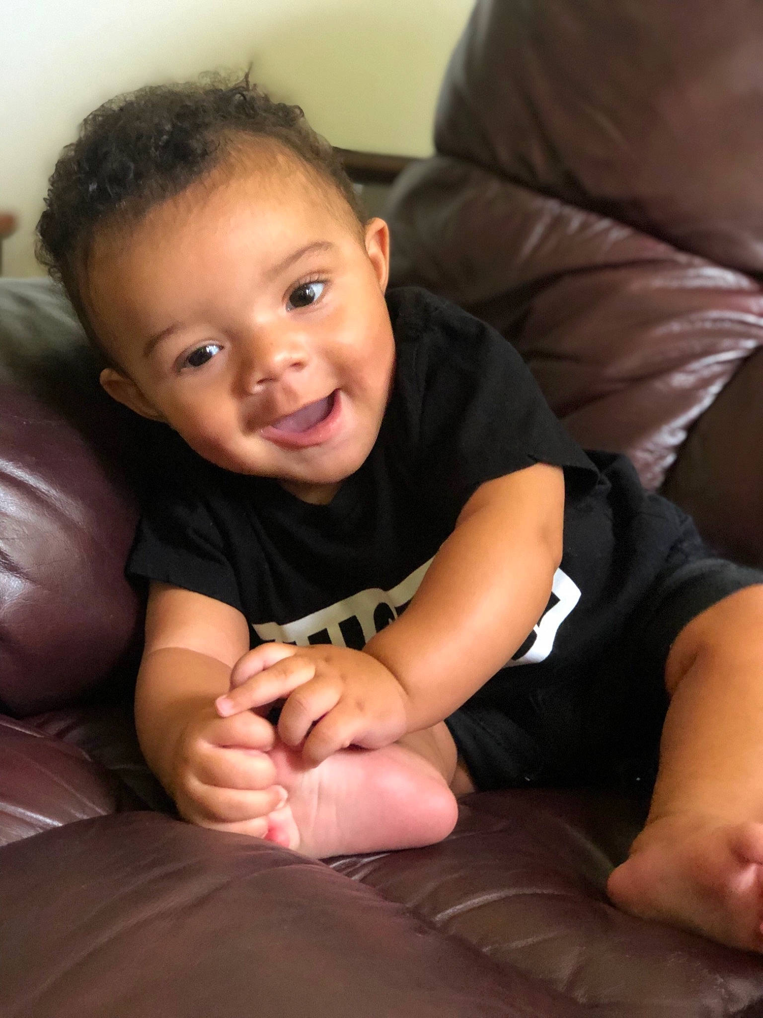 Izayah joined the competition — help win amazing prizes! arm, baby, cheek, child, face, finger, fun, gesture, hand, head, joy, leg, nose, person, sitting, skin, smile, sole, thigh, thumb