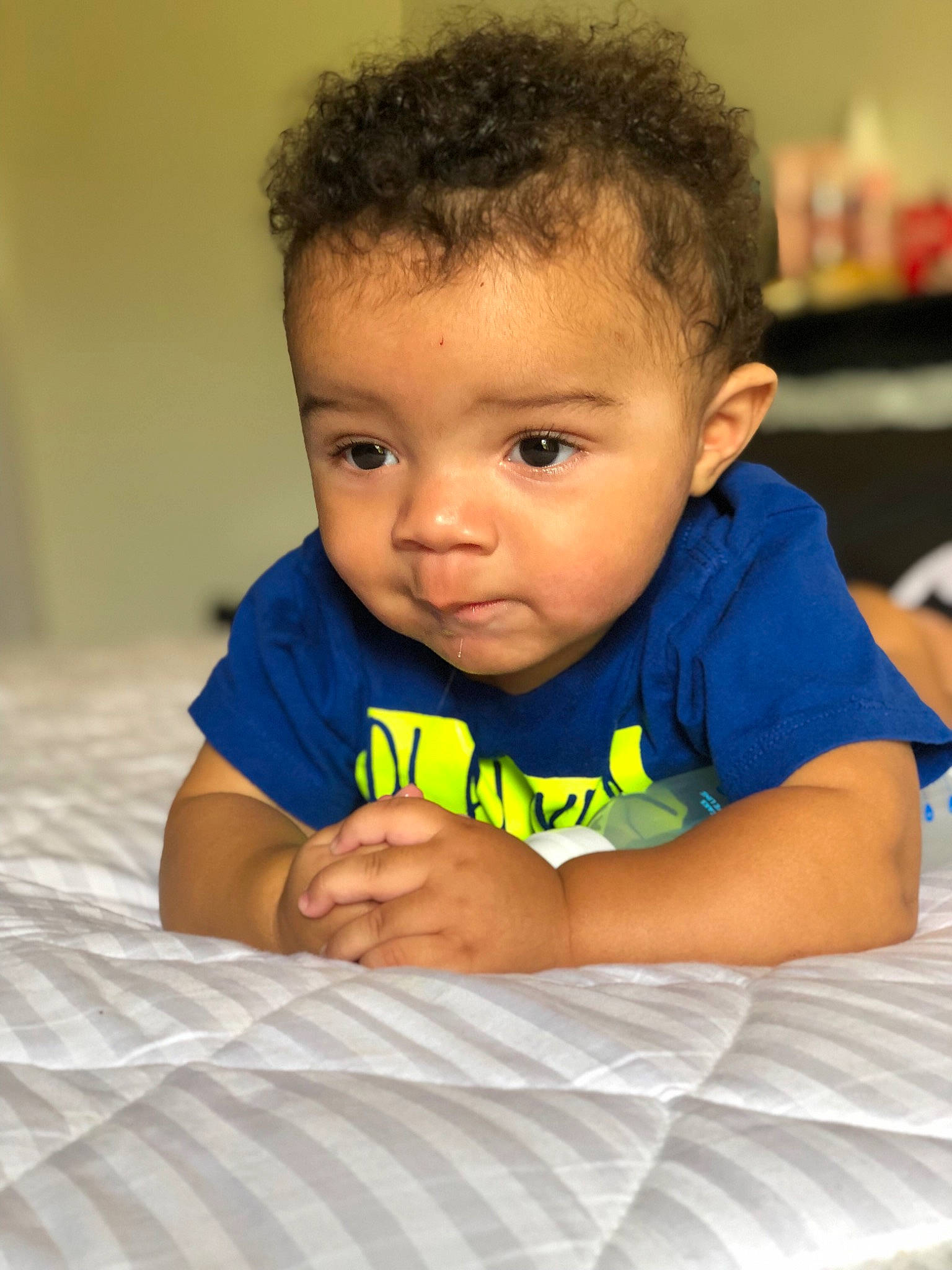 Izayah is registered to the contest to win money with this photo: baby, cheek, child, chin, eye, face, forehead, head, lip, nose, person, skin, toddler, tummy_time