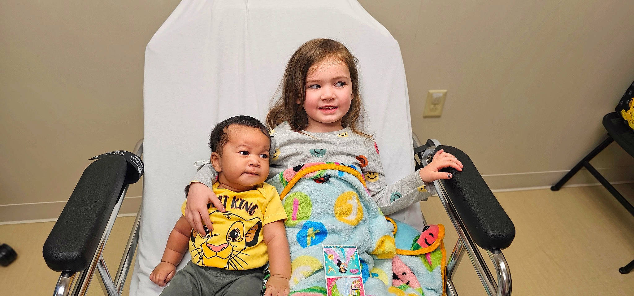 Alexandria is registered to the contest to win money with this photo: baby, beauty, chair, child, comfort, event, eye, facial_expression, fun, hairstyle, happy, human, joy, leisure, person, room, sharing, sitting, skin, t_shirt