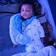 Kamazi is registered to the contest to win money with this photo: baby, sleeping, blanket, plush_toy, elephant, bottle, crib, blue_light, pajamas, infant, soft_toys, sleepwear, peaceful, child, bed, cozy, indoors, rest, cute, comfort