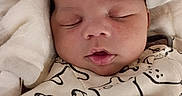 Jamari is registered to the contest to win money with this photo: baby, blanket, child, clothing, comfort, cozy, cute, eyelids, face, head, indoors, infant, mouth, newborn, peaceful, portrait, resting, skin, sleeping, soft