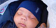 Jamari is registered to the contest to win money with this photo: baby, sleeping, car_seat, pacifier, hat, jacket, blanket, child, face, closeup, infant, cozy, warm, bundle, seatbelt, rest, cute, portrait, indoors, comfort