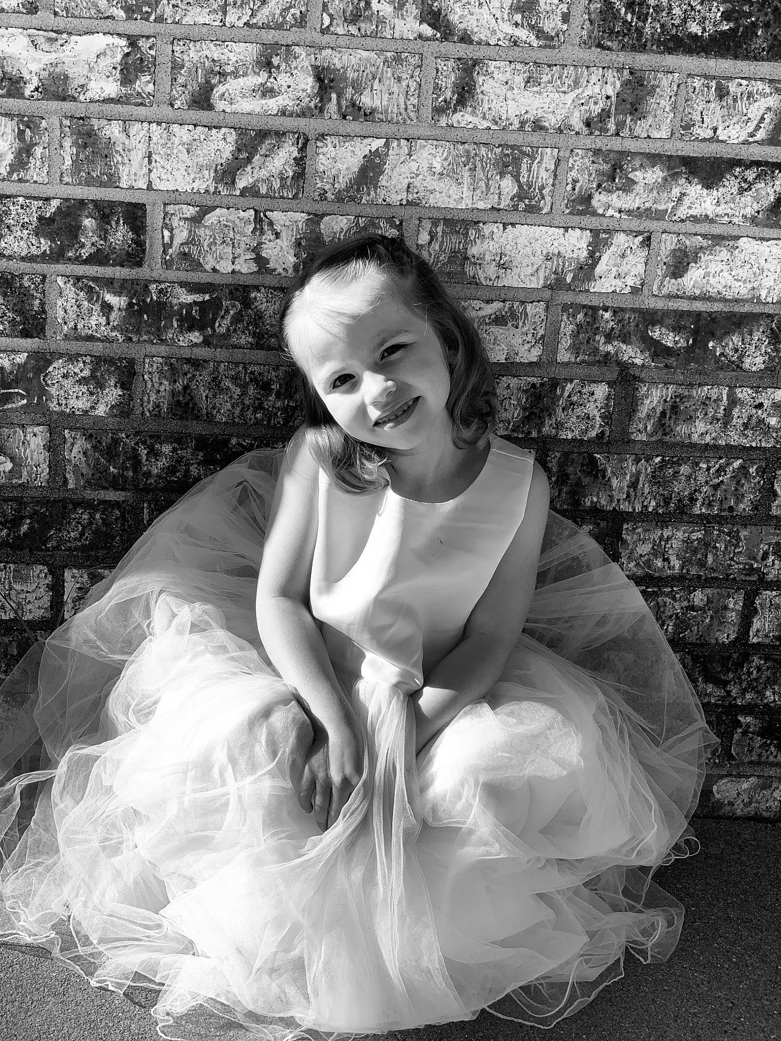 Snow is registered to the contest to win money with this photo: ballet_tutu, beauty, black_and_white, bridal_accessory, bridal_clothing, bride, child, dress, gown, joy, long_hair, monochrome, monochrome_photography, person, photo_shoot, photograph, photography, sitting, smile, stock_photography