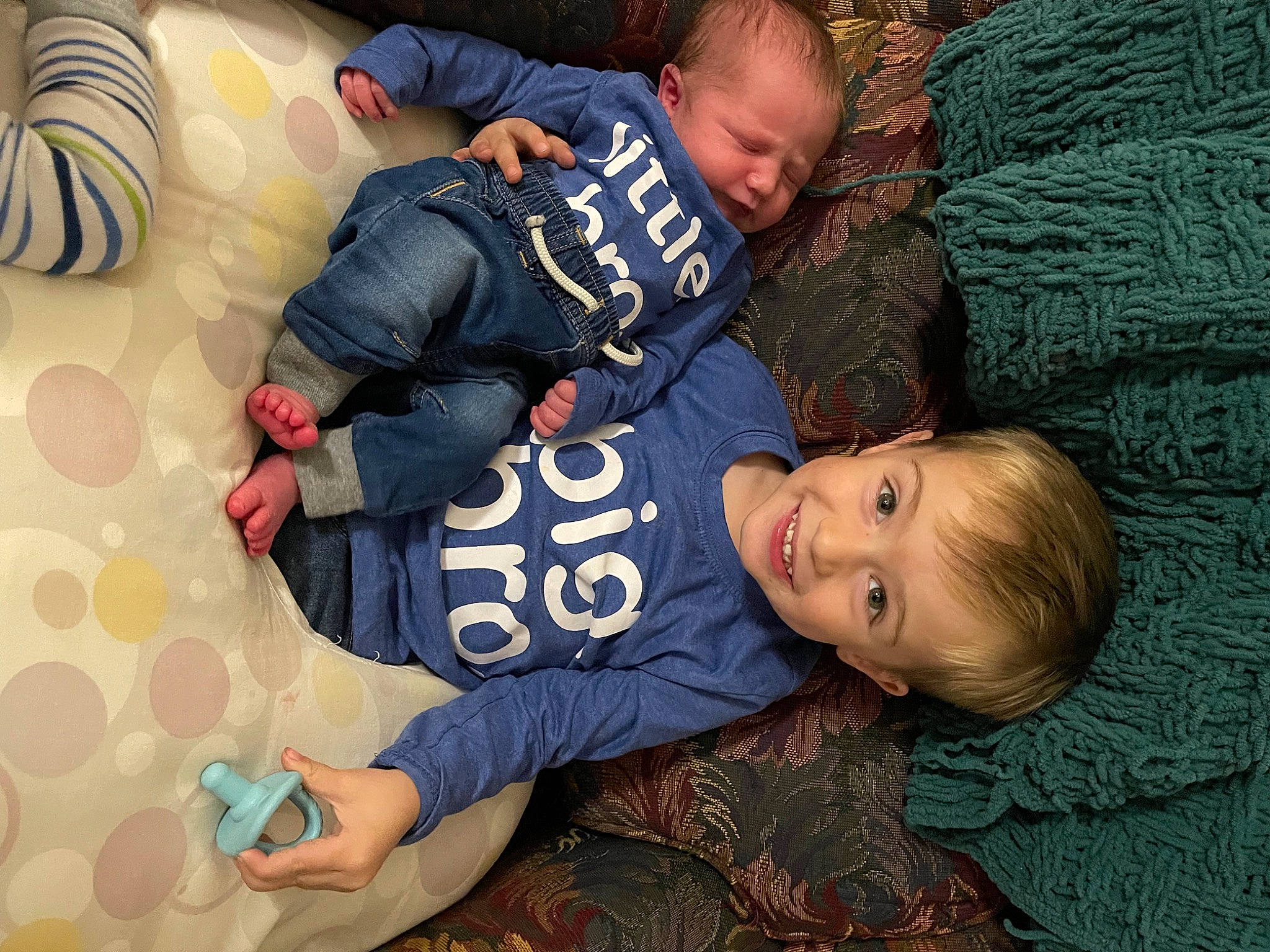 Brayden joined the competition — help win amazing prizes! baby, baby_toddler_clothing, child, comfort, face, fun, grass, hair, hairstyle, happy, head, joy, lap, pattern, person, room, sitting, sleeve, smile, t_shirt