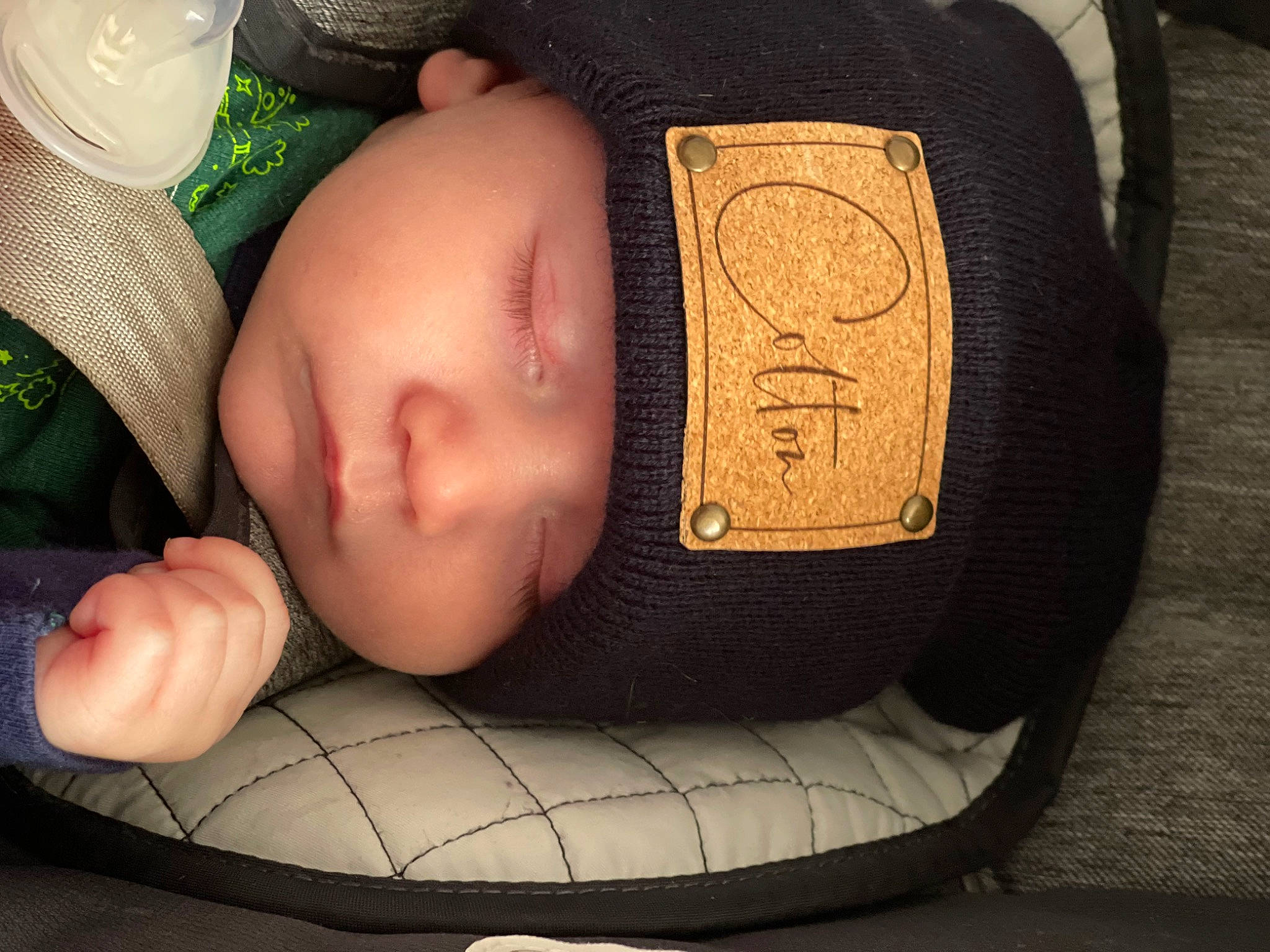 Colton is registered to the contest to win money with this photo: arm, baby, baby_sleeping, baby_toddler_clothing, cheek, comfort, cool, eye, eyebrow, eyelash, fashion_accessory, finger, hand, head, headgear, headwear, human_body, mouth, person, skin