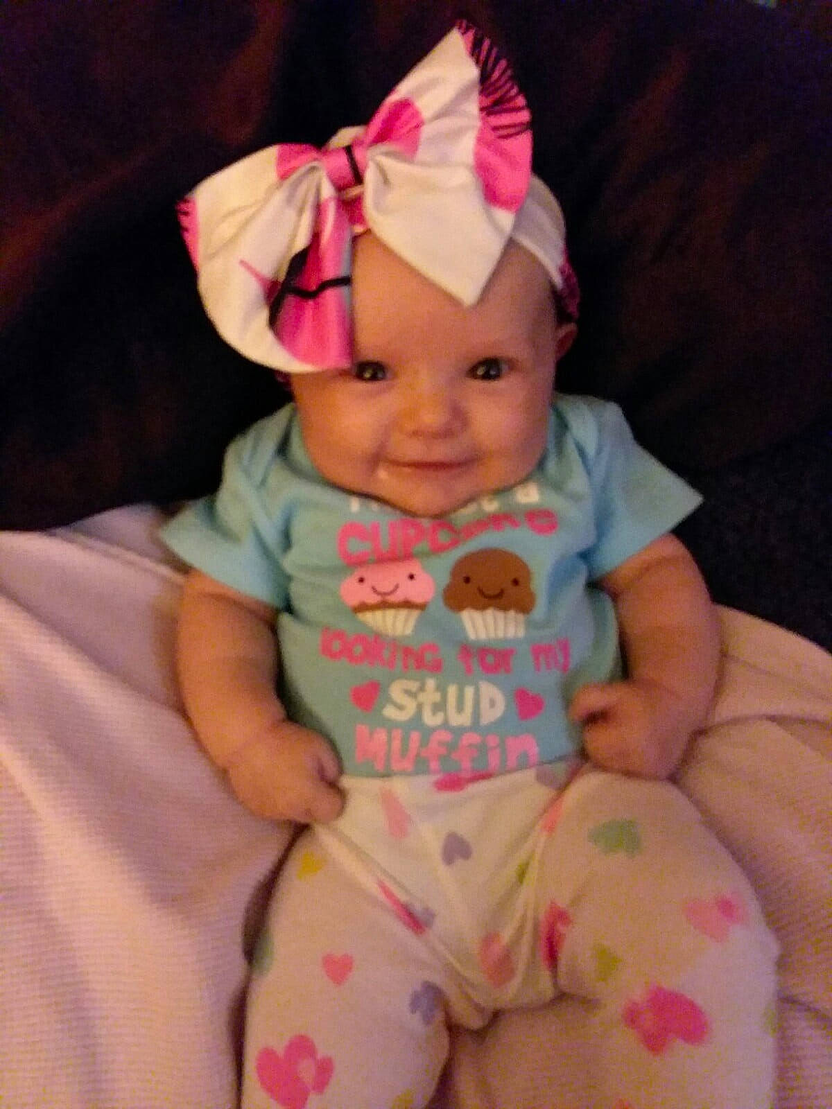 Shaelynn is registered to the contest to win money with this photo: baby, baby_products, baby_toddler_clothing, cheek, child, hair_accessory, headgear, person, pink, product, skin, smile, toddler