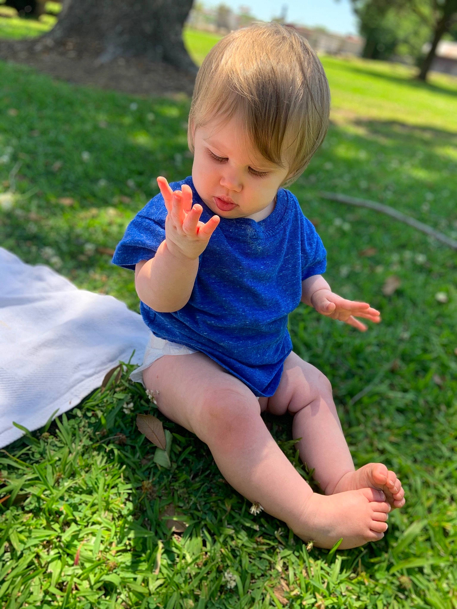 Kyleigh is registered to the contest to win money with this photo: ankle, baby, baby_toddler_clothing, barefoot, child, finger, foot, grass, grass_family, hand, knee, lawn, people_in_nature, person, play, slipper, sock, summer, thumb, toddler