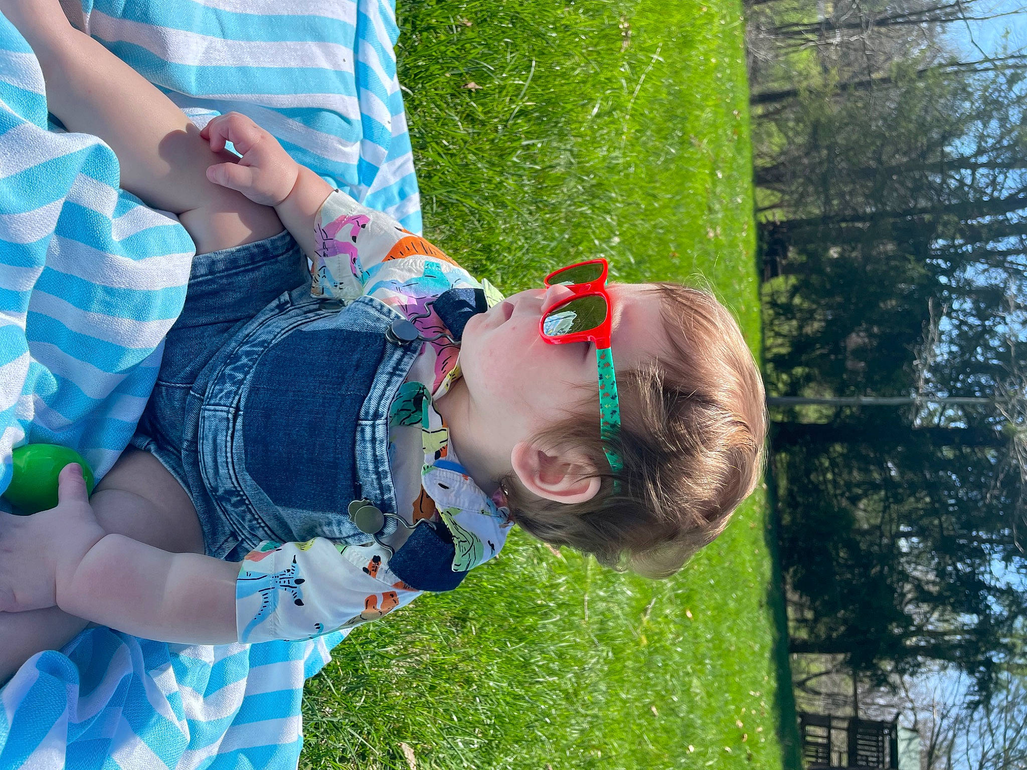 Westley joined the competition — help win amazing prizes! blue, child, cool, electric_blue, eyewear, fun, glasses, grass, green, hand, happy, human_leg, leisure, people_in_nature, person, plant, recreation, smile, sunglasses, toddler