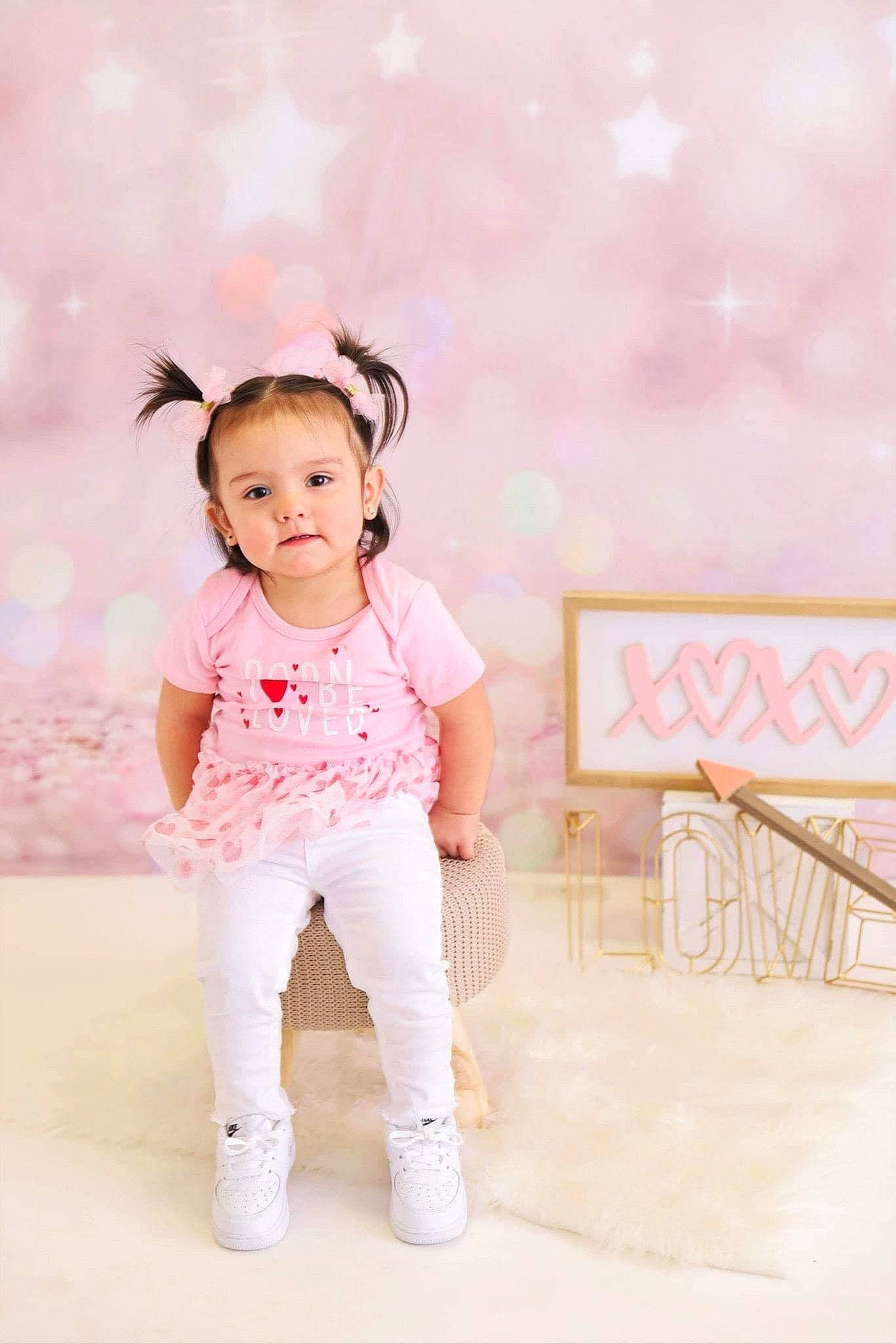 Ana is registered to the contest to win money with this photo: baby_toddler_clothing, dress, face, fashion_design, flash_photography, gesture, hair, happy, human_body, knee, leg, neck, person, pink, shoulder, skin, sleeve, street_fashion, thigh, toddler