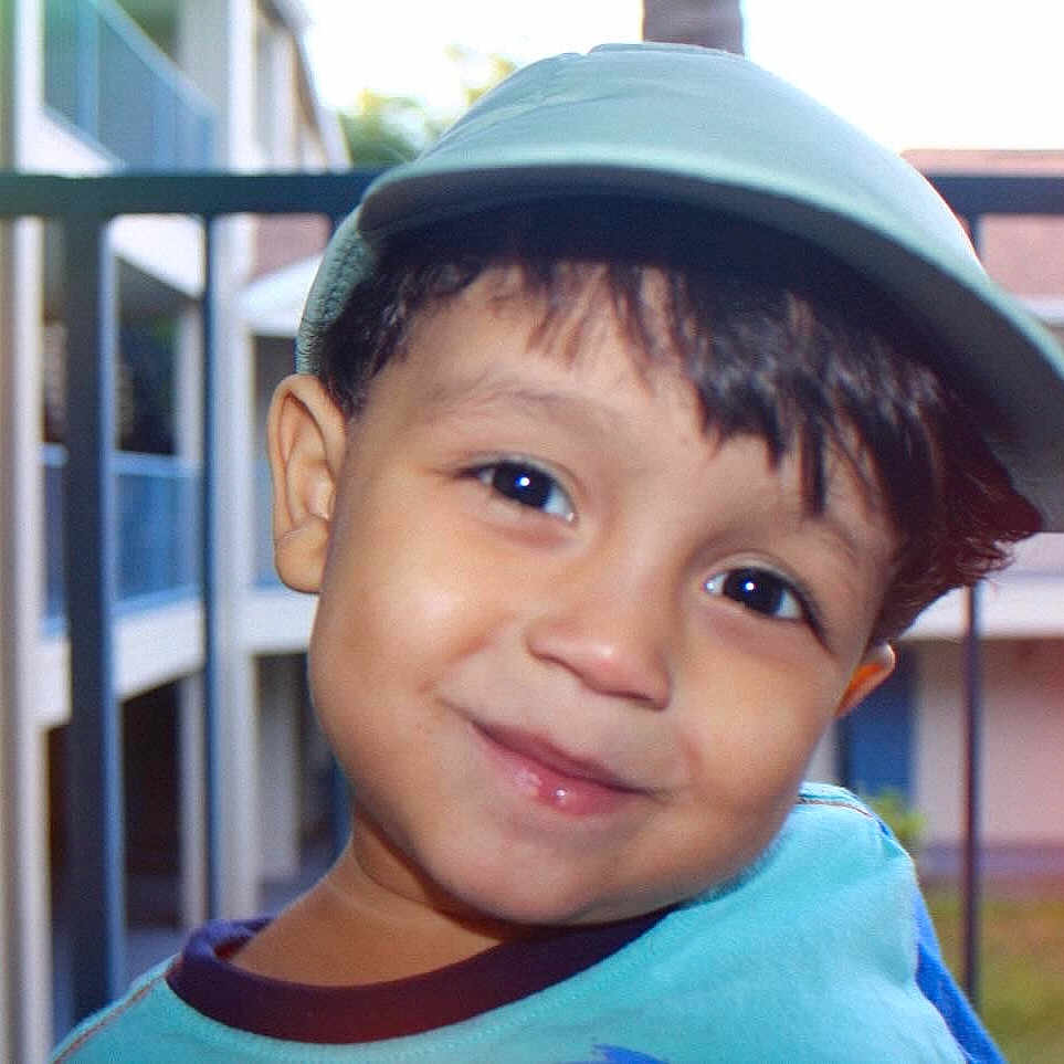 Tyllon joined the competition — help win amazing prizes! baby, baseballcap, cap, city, clothing, door, face, happy, hardhat, hat, head, helmet, people, person, photography, plant, portrait, railing, smile, t_shirt