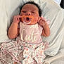 Nyari joined the competition — help win amazing prizes! baby, newborn, pacifier, clothing, onesie, skirt, bow, floral, bed, blanket, sleepy, infant, cute, pastel_colors, person, lying_down, soft_texture, indoors, child, adorable