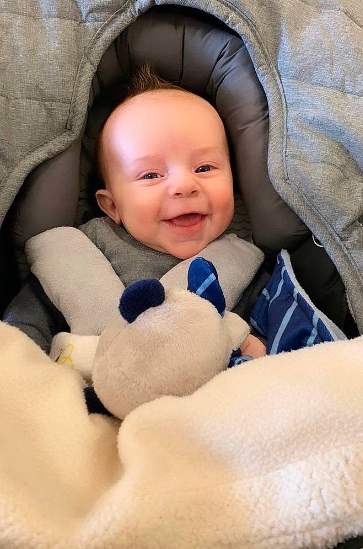 Calum joined the competition — help win amazing prizes! baby, baby_products, baby_sleeping, baby_toddler_clothing, cheek, child, close_up, comfort, eye, face, facial_expression, finger, happy, linens, nose, person, sitting, skin, smile, textile