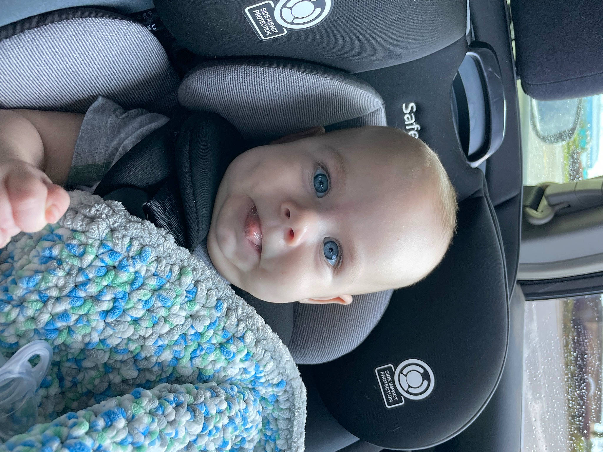 Jackson is registered to the contest to win money with this photo: auto_part, automotive_design, automotive_lighting, automotive_tire, automotive_wheel_system, baby, baby_carriage, baby_products, baby_toddler_clothing, blue, car_seat, child, comfort, electric_blue, eye, hand, person, sitting, smile, toddler