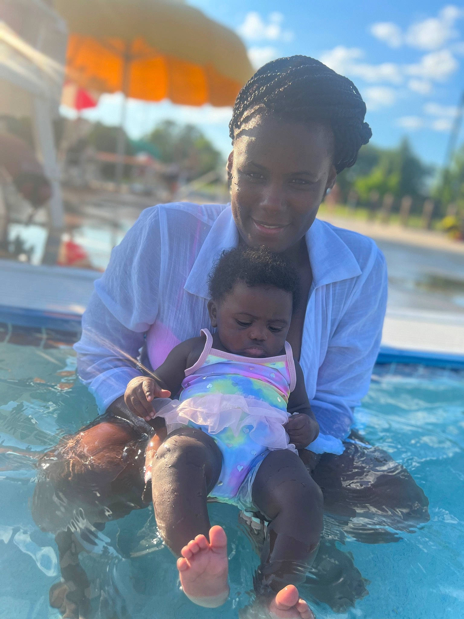 Dereana is registered to the contest to win money with this photo: aqua, azure, baby, cloud, event, face, fun, happy, joy, leisure, person, photograph, recreation, sky, smile, snapshot, summer, swimming_pool, toddler, travel
