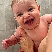 Lindsay joined the competition — help win amazing prizes! baby, child, person, smiling, happy, bathroom, shower, wet_hair, skin, hand, holding, cute, infant, earrings, water, tiles, adult, closeup, portrait, naked