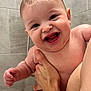 baby, child, person, smiling, happy, bathroom, shower, wet_hair, skin, hand, holding, cute, infant, earrings, water, tiles, adult, closeup, portrait, naked