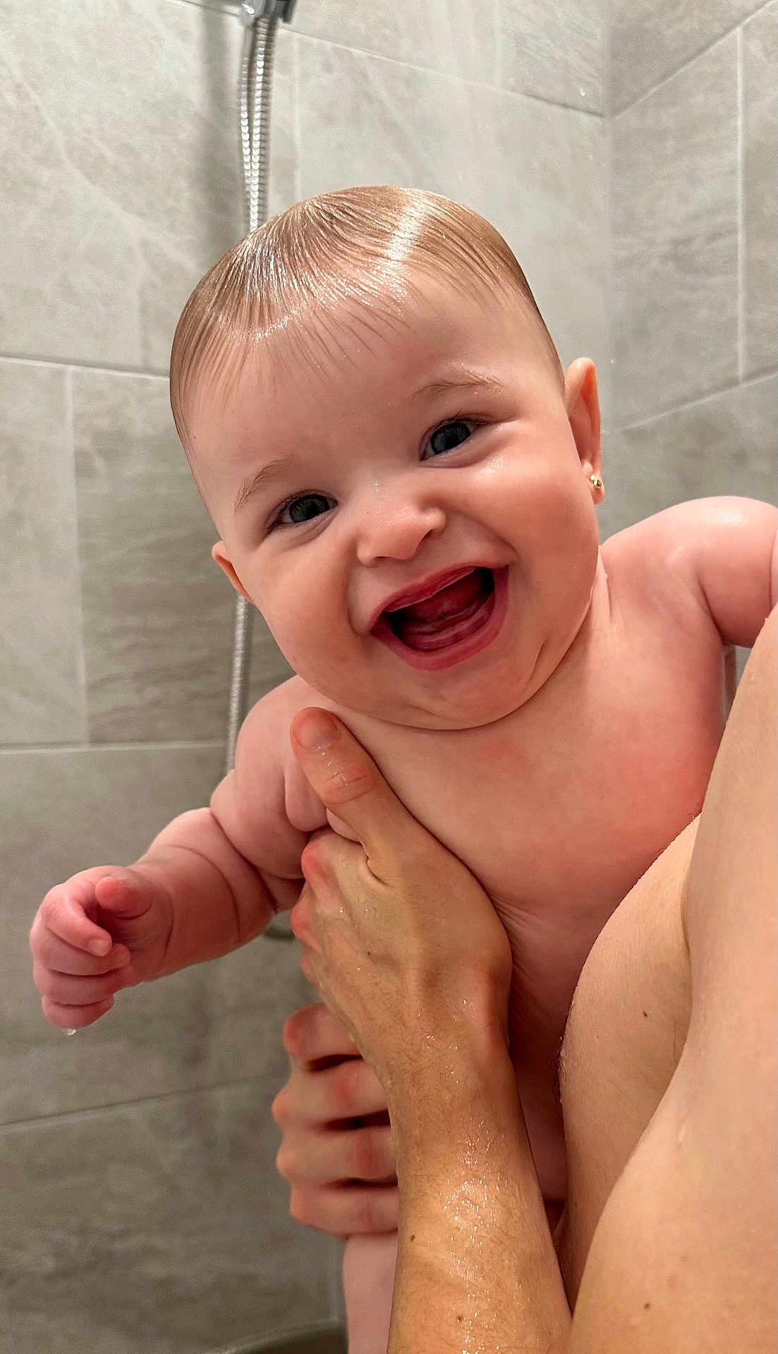 Lindsay joined the competition — help win amazing prizes! baby, child, person, smiling, happy, bathroom, shower, wet_hair, skin, hand, holding, cute, infant, earrings, water, tiles, adult, closeup, portrait, naked
