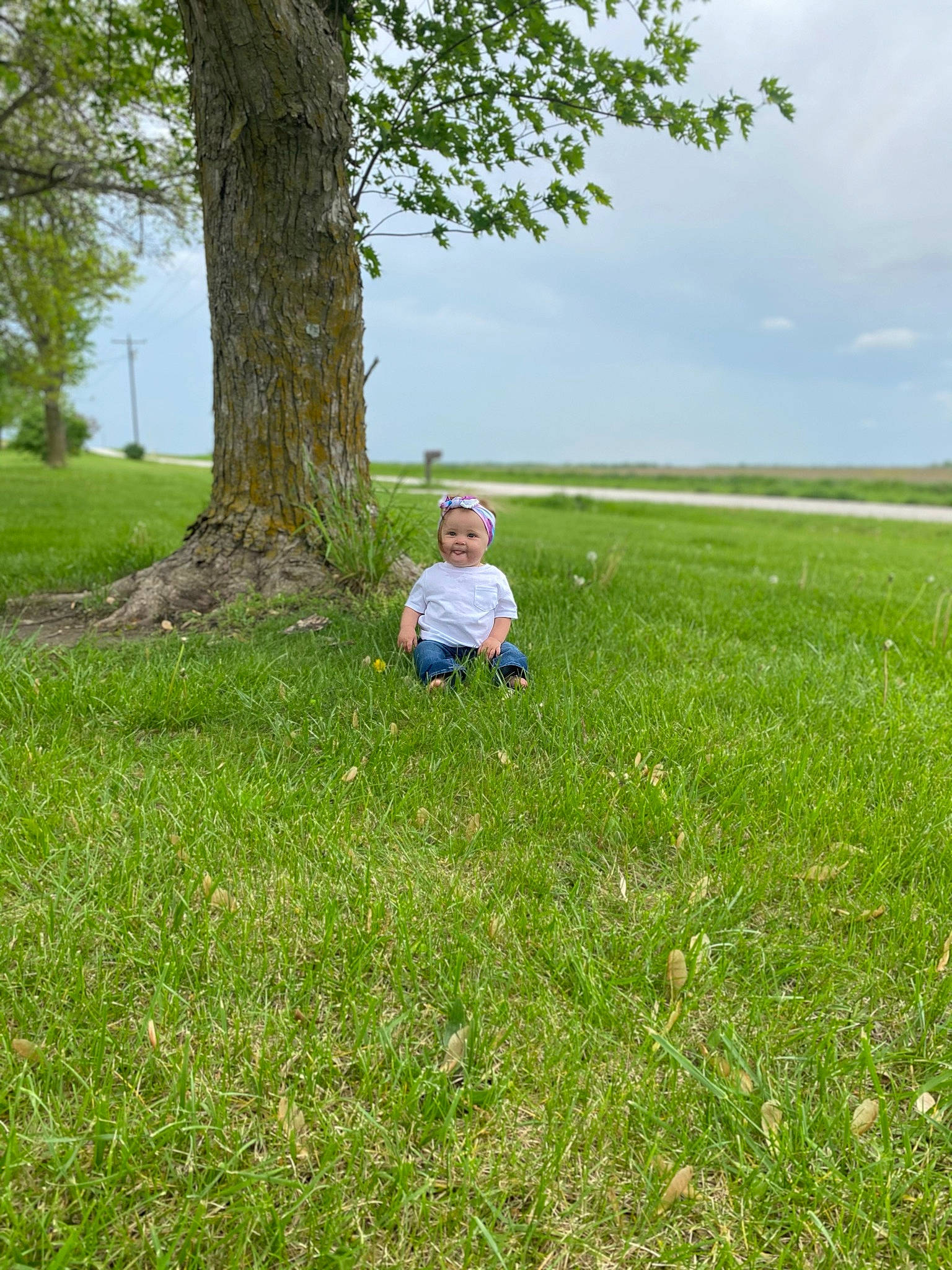 Lynnlee is registered to the contest to win money with this photo: cloud, grass, grass_family, grassland, groundcover, happy, headwear, joy, landscape, lawn, leisure, meadow, natural_landscape, pasture, people_in_nature, person, plant, prairie, recreation, shrub