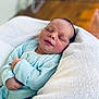 Jarrah is registered to the contest to win money with this photo: newborn, baby, sleeping, blanket, cozy, onesie, infant, child, soft_focus, indoors, portrait, peaceful, cute, wrapped, tender, skin, head, hands, resting, comfort