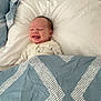 Jarrah is registered to the contest to win money with this photo: baby, blanket, bed, pillow, smile, sleepwear, infant, face, happy, fabric, pattern, comfort, cozy, rest, cute, child, toddler, indoors, portrait, relaxation