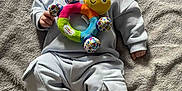 Jarrah joined the competition — help win amazing prizes! baby, infant, smile, toy, plush_toy, colorful, blanket, clothing, comfortable, happy, cute, lying_down, soft_texture, indoors, child, feet, hand, face, casual, cozy