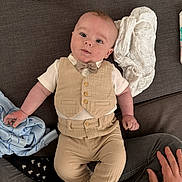 Marley- Jay joined the competition — help win amazing prizes! baby, infant, child, vest, bow_tie, couch, blanket, shoes, hands, clothing, portrait, indoor, fabric, cute, smiling, person, sitting, home, soft, cozy