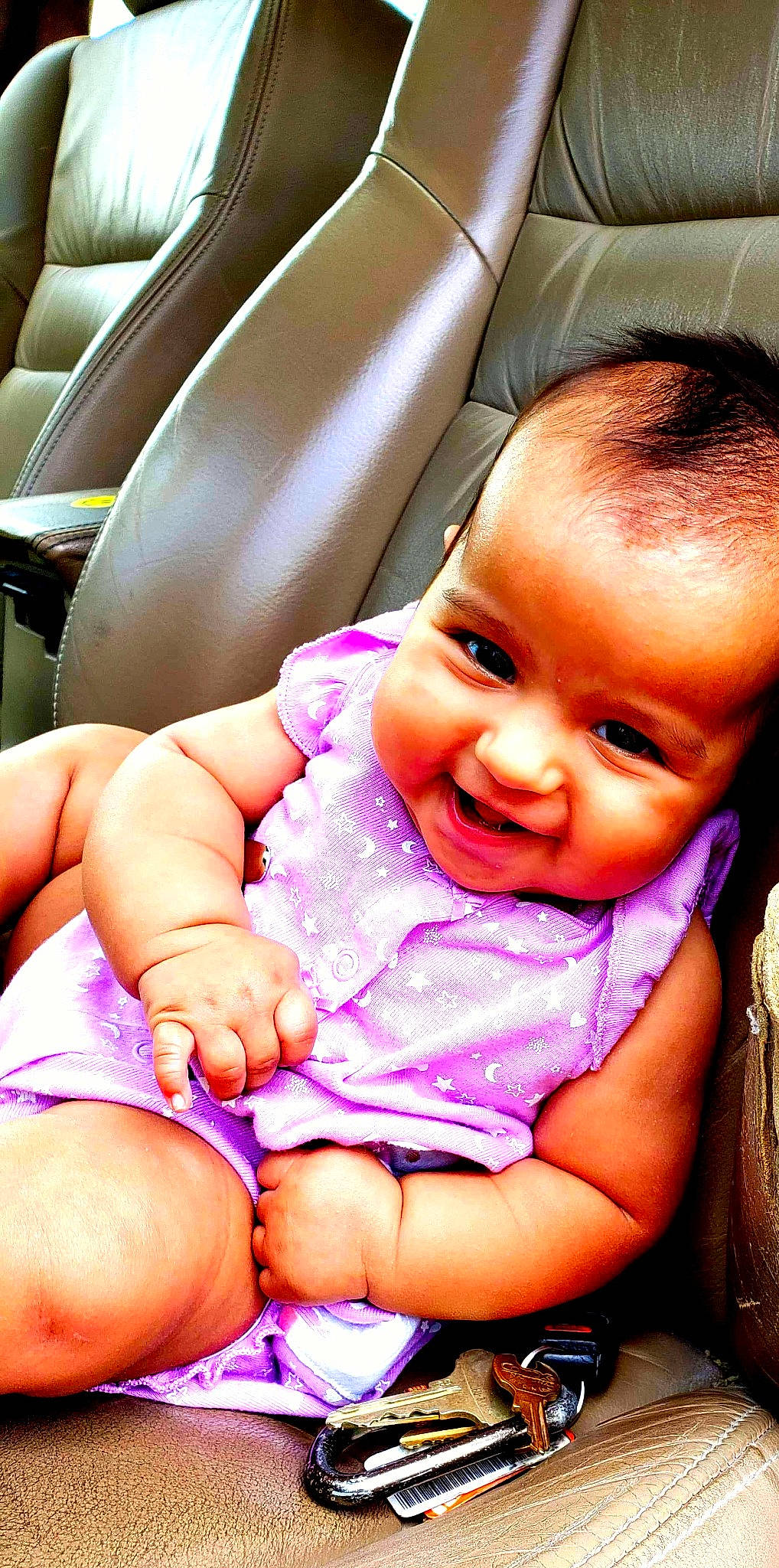 Mia is registered to the contest to win money with this photo: baby, cheek, child, finger, hand, joy, lip, mouth, person, pink, sitting, skin, smile, thumb, toddler