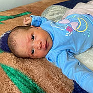 Yeimy joined the competition — help win amazing prizes! baby, newborn, infant, blue_clothing, blanket, patterned_blanket, face, eyes, lying_down, cute, child, person, indoors, soft_texture, small_hand, sleepwear, newborn_baby, portrait, cozy, resting