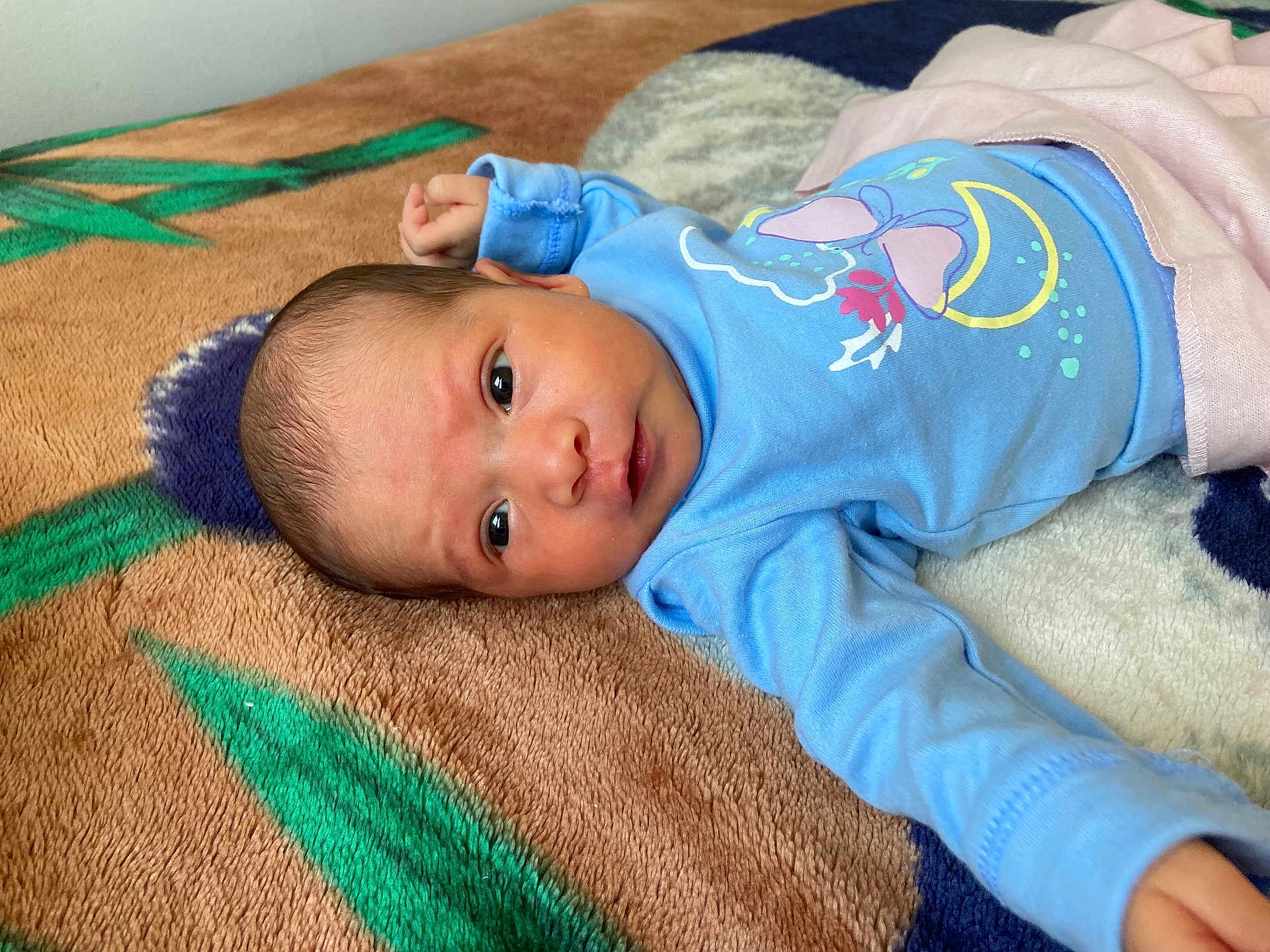 Yeimy joined the competition — help win amazing prizes! baby, newborn, infant, blue_clothing, blanket, patterned_blanket, face, eyes, lying_down, cute, child, person, indoors, soft_texture, small_hand, sleepwear, newborn_baby, portrait, cozy, resting